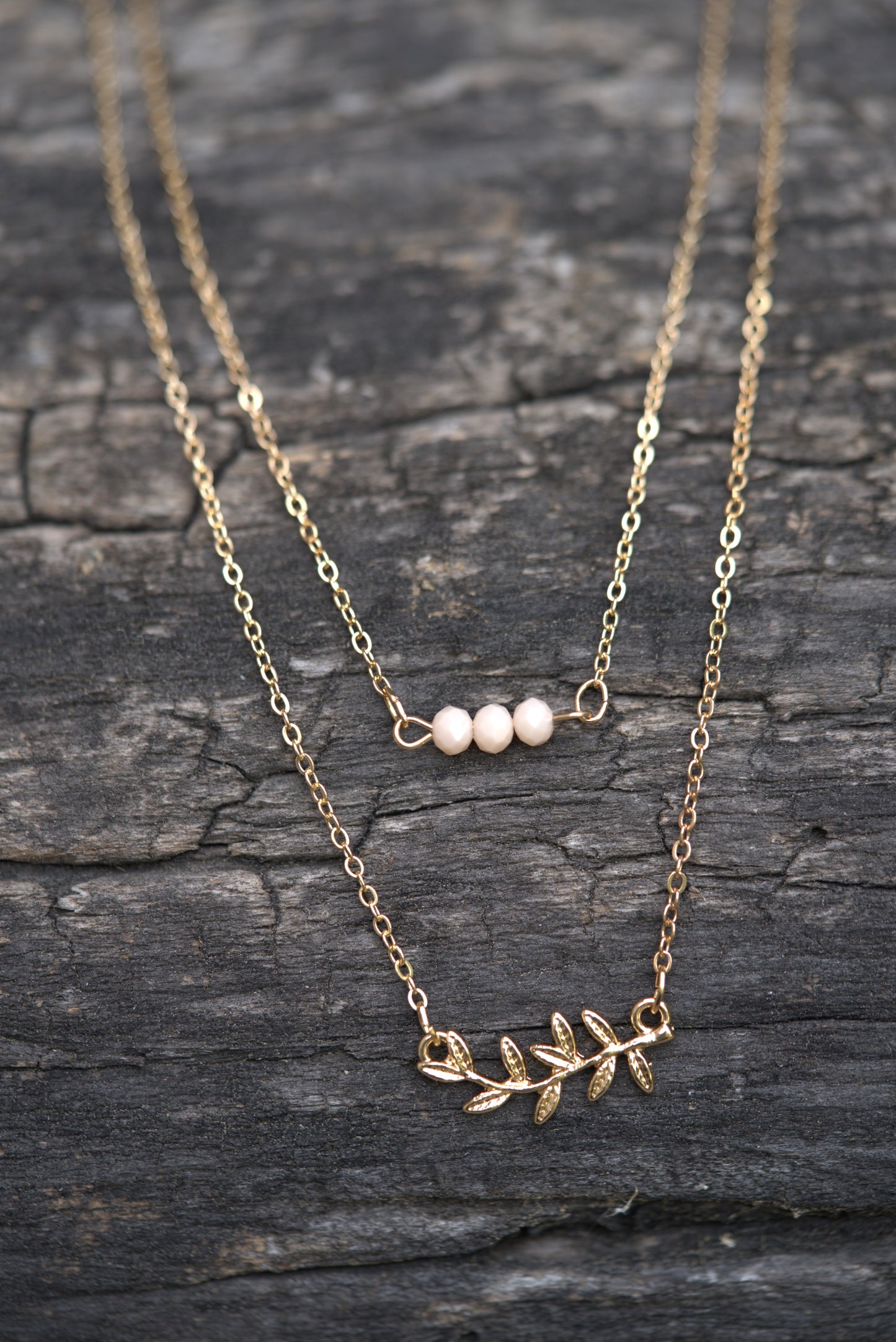 Gold Layered Necklace with Leaf Pendant and Beaded Bar Charm
