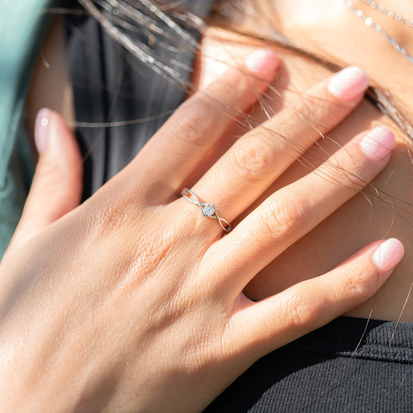 Stainless twisted band CZ stone