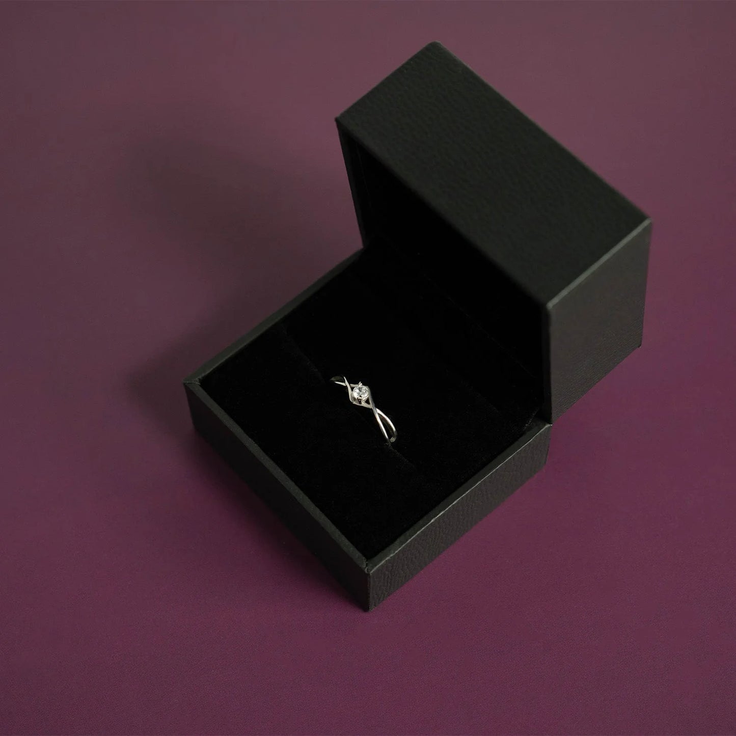 Stainless twisted band CZ stone